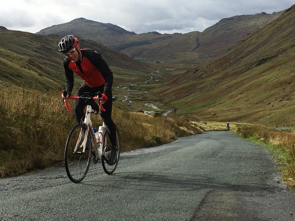 Man on road bike in Great Langdale